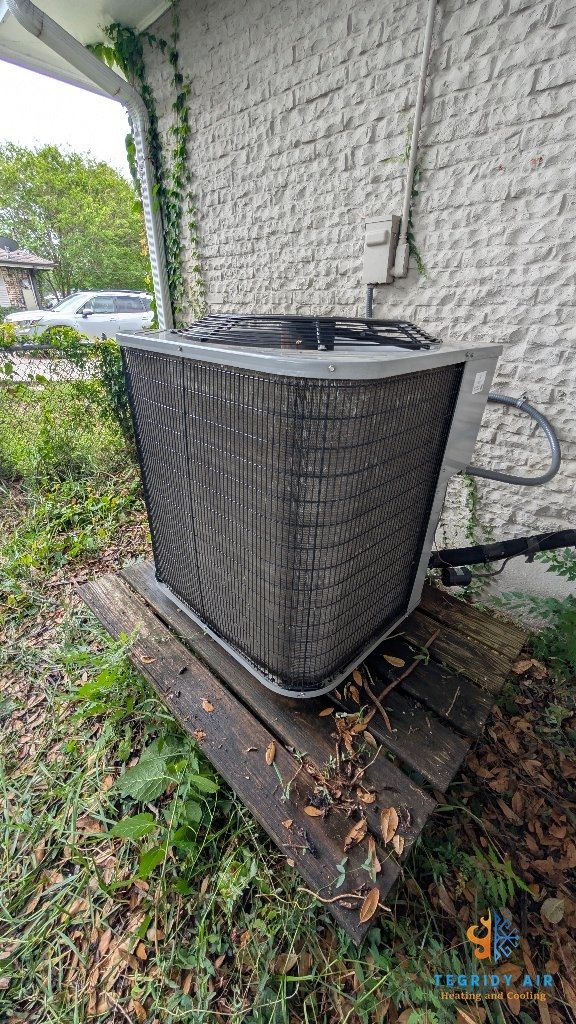 AC condenser unit cleaned and cleared by Tegridy Air Kenner LA
